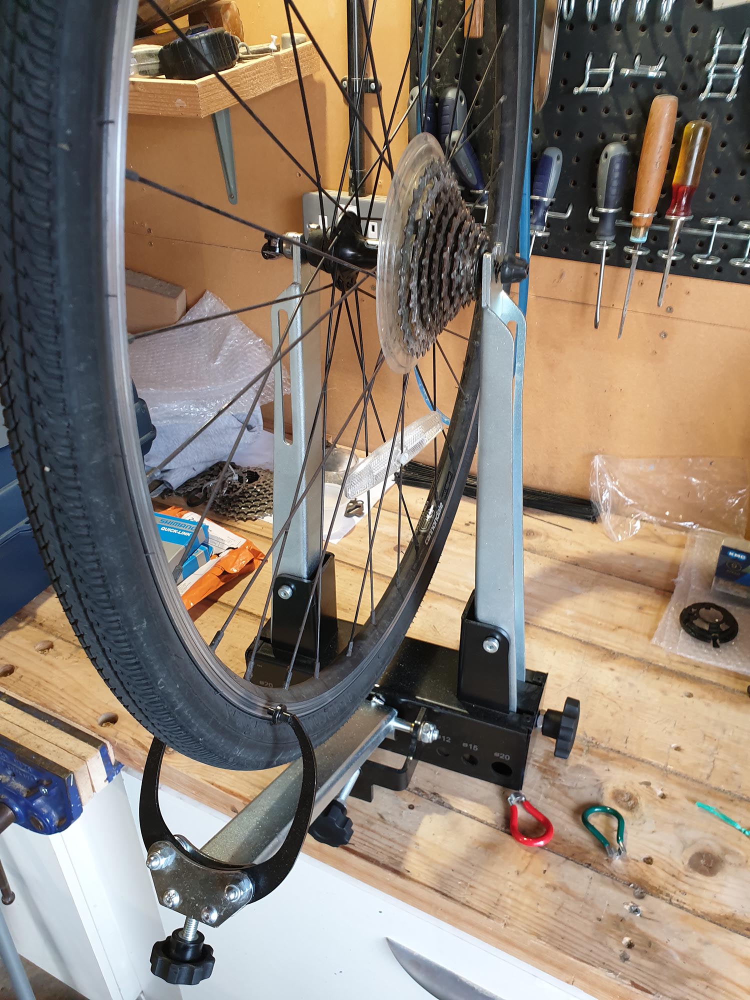 Rear wheel out of true. Placed in a truing jig and re-trued. Ipswich.